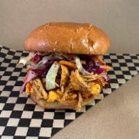 Kicken Chicken · Hot BBQ Pulled Chicken with Pimento Cheese and Carolina Slaw on a Toasted Brioche Bun
