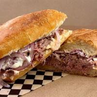 The Royale · Shaved house made roast beef with red onions, roasted tomato aioli and horseradish-goat chee...