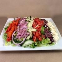 Greek Salad · Romaine, tomato, cucumber, red pepper, Kalamata olives, red onion and feta with lemon vinaig...