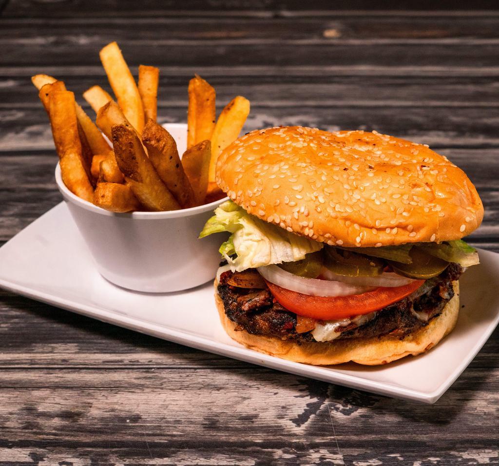 Vaquera Burger · Clasico burger topped with arrachera steak, cheese, fresh avocado, grilled  onions and chorizo.