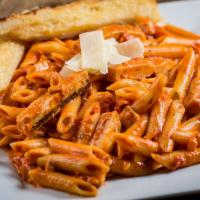 Penne and Grilled Chicken a la Vodka · Penne pasta simmered in a creamy vodka sauce topped with our tender grilled chicken breast, ...