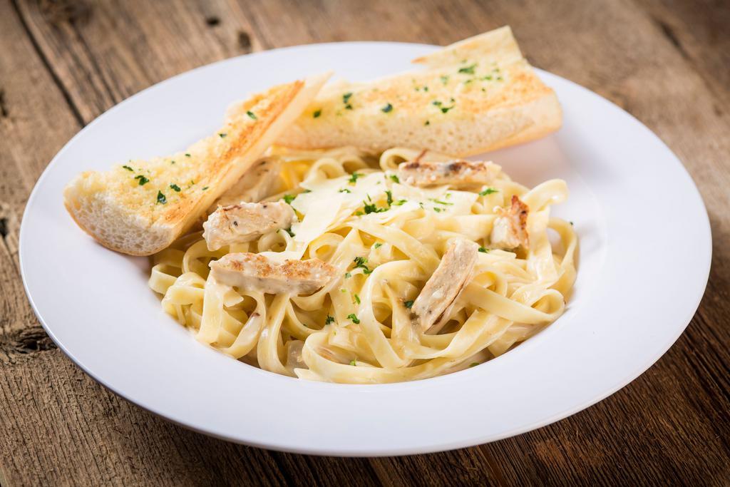 Fettuccine Alfredo with Grilled Chicken · Fettuccine noodles and tender grilled chicken tossed in a rich, creamy Alfredo
sauce made with Asiago and Romano cheeses with a hint of garlic and fresh parsley. Served with a side of garlic bread and Romano cheese.