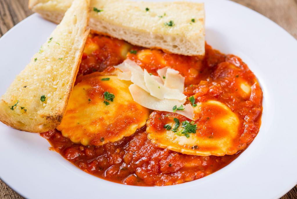 4 Cheese Ravioli · Serves 1-3. Ravioli with marinara sauce stuffed with ricotta, Parmesan, Asiago and Romano cheeses, topped with shaved Asiago cheese and fresh parsley. Served with a side of garlic bread and Romano cheese.