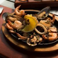 Botana del Mar · Shrimp, octopus, calamari and mussels in garlic white wine sauce.