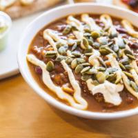 Harvest Chili · Topped with Cashew Creme & Pepita Seeds.