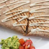 Southwest Quesadilla · Grilled. Whole wheat tortilla, cashew cheese, wild rice, black bean and corn salsa, red pepp...