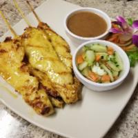 A11. 4 Chicken Satay · Marinated choice of chicken in coconut milk and Thai spices on skewered and grilled. Served ...