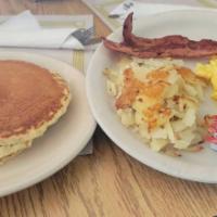 #1. One Egg · Served with two strips of bacon, sausage or ham, hash browns or Obrien potatoes, two pancake...