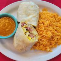 American Burrito · Scrambled eggs, chopped ham and sausage, tomato and american cheese.