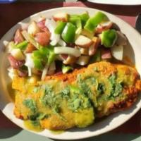 Damian Omelette · Mexican sausage, mexican cheese avocado and green sauce on top. Three egg omelletes are pan ...
