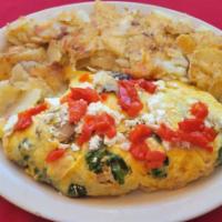 Village Omelette · Spinach, tomato, mushrooms and feta cheese. Three egg omelletes are pan fried, served with s...