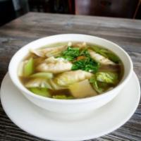 Dumpling Soup · Seven dumplings in a clear vegetable broth with shitake mushrooms, celery and napa cabbage.