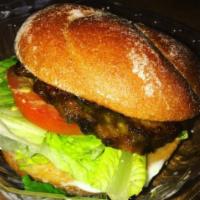 Cowboy Burger · Homemade wheat meat. Served with romaine lettuce, alfalfa sprouts, tomato and vegenaise in a...