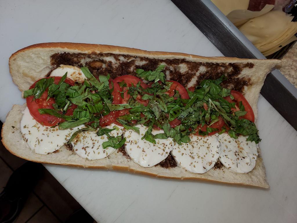 Lady Cafe Special Cold Sub · Fresh mozzarella, sweet plum tomatoes and hearty basil, drizzled with olive oil and balsamic vinegar. On our fresh baked bread. (VGT)
