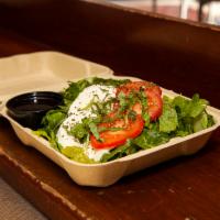 Cafe Salad · Fresh mozzarella and plum tomatoes with fresh basil on a bed of romaine lettuce, with balsam...