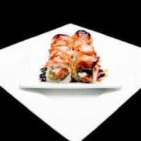 Anemone Roll · Spicy crab, cream cheese and avocado inside, fresh salmon on top and baked with special sauce.