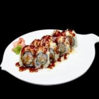 Joy Roll · Crabmeat, tempura shrimp and baked coconut flakes inside, crunch on top with eel sauce.