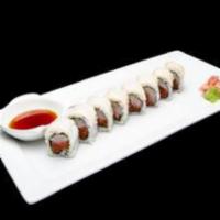 Osaka Roll · Raw. Spicy tuna, yellowtail, and cucumber inside, super white tuna on top with ponzu sauce.