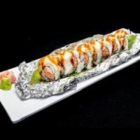 White Fire Roll · Spicy crab and cream cheese inside, white tuna on top with eel sauce and spicy mayo sauce.