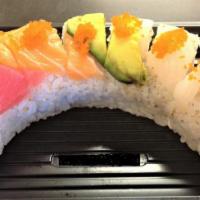 Rainbow Maki · Uramaki with kanimi crab, avocado and cucumber. Topped with maguro, salmon, ika, ebi and avo...