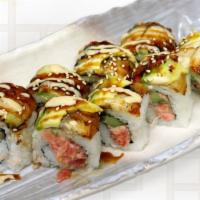 Hawaiian Maki · Uramaki with spicy ahi and cucumber. Topped with unagi and avocado. Finished with spicy sauc...