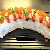 Tiger Maki · Uramaki with shrimp tempura, kanimi crab and cucumber. Topped with spicy ahi. Finished with ...