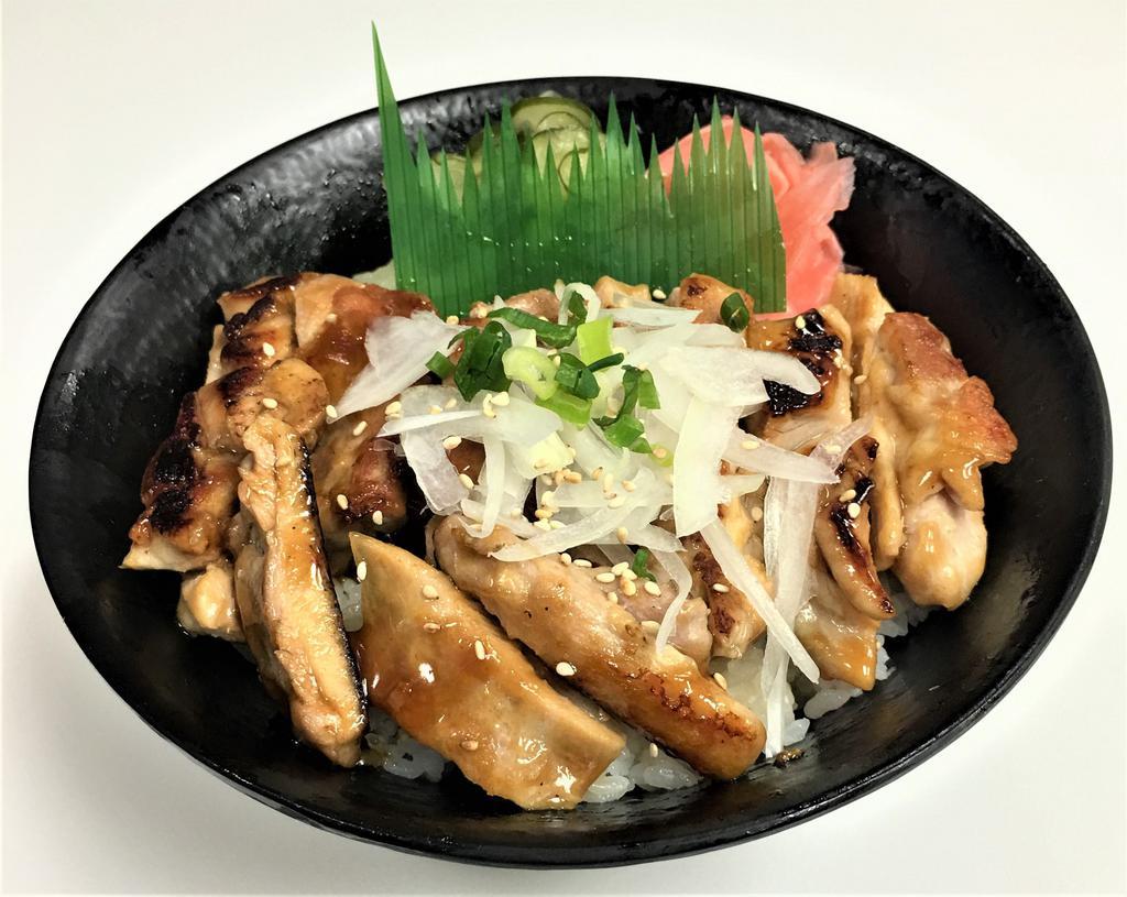 Teriyaki Chicken Donburi · Sushi rice, teriyaki chicken, teriyaki sauce, white onions, green onions, ginger, namasu and sesame seeds.