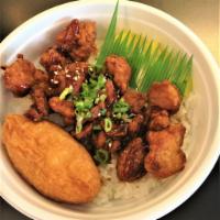 Chicken Donburi · Sushi rice, karaage chicken, teriyaki sauce, inari, shinko, green onions and sesame seeds.