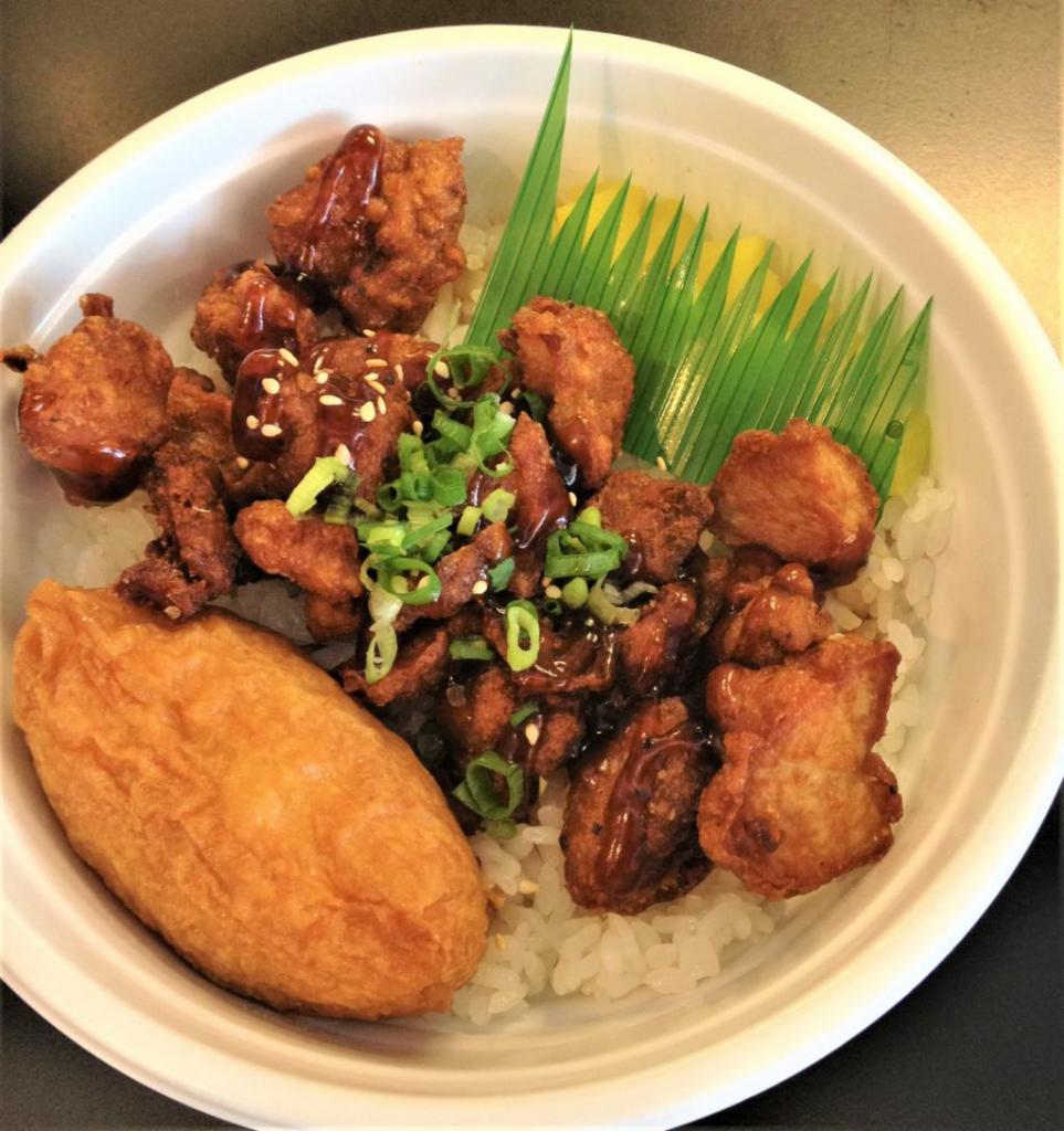 Chicken Donburi · Sushi rice, karaage chicken, teriyaki sauce, inari, shinko, green onions and sesame seeds.