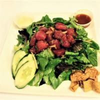 Poke Salad · Mixed greens, shoyu poke, cherry tomatoes, one ton chips, lion sauce (sweet chili sauce) and...