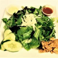 Spring Salad · Mixed greens, white onions, cherry tomatoes, one ton chips, lion sauce (sweet chili sauce) a...