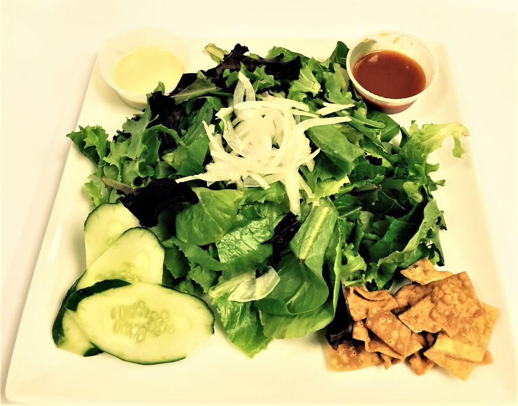 Spring Salad · Mixed greens, white onions, cherry tomatoes, one ton chips, lion sauce (sweet chili sauce) and wasabi mayo sauce.