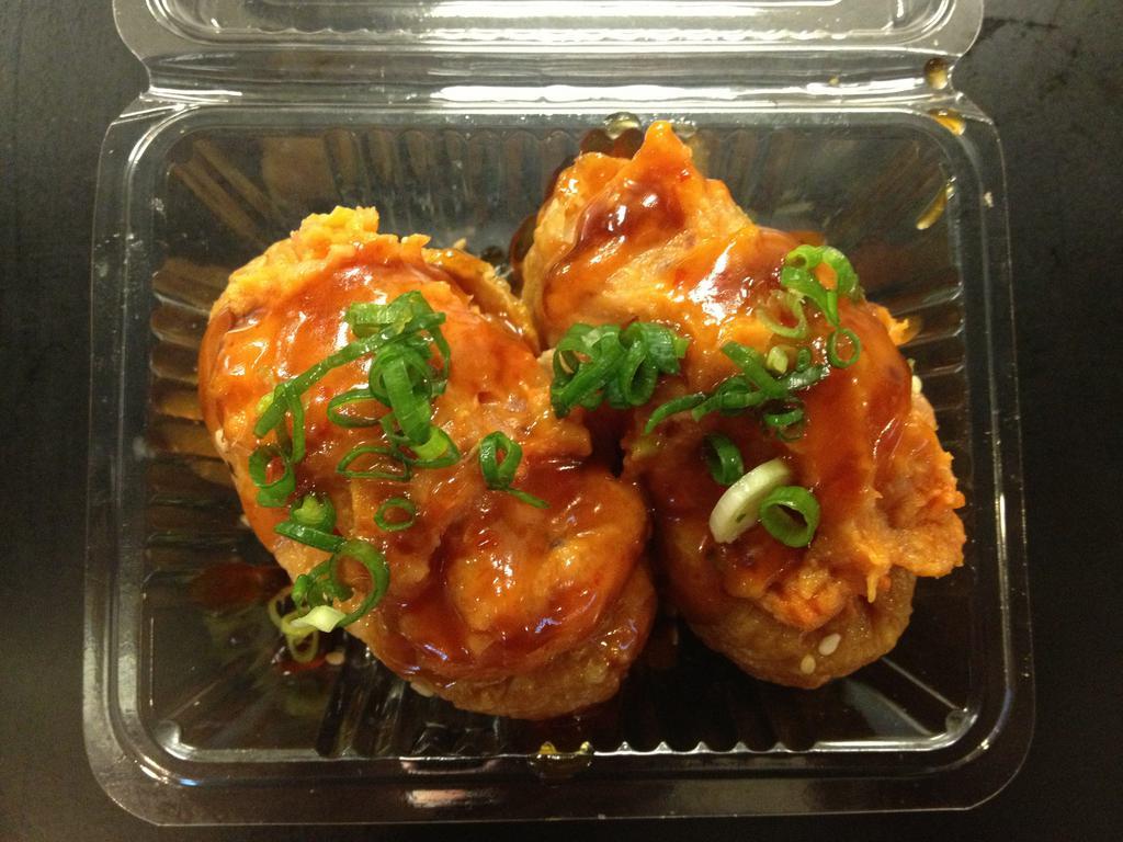 Spicy Ahi Inari  · 2 pieces.  Inari stuffed with extra spicy ahi and topped with green onions.