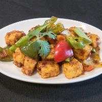 Chili Paneer · Cottage cheese cubes stir fried with peppers, onions and spicy chili sauces.