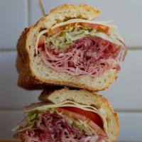 Lg Italian Combo Sub · Premium Imported Genoa Salami, Hot Cooked Cappy, and Provolone. Sandwich comes with lettuce,...