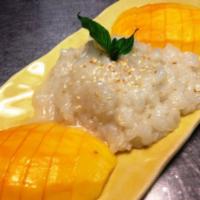 Mango with sweet sticky rice · Fresh ripe mango with sweet coconut milk on sweet sticky rice. 