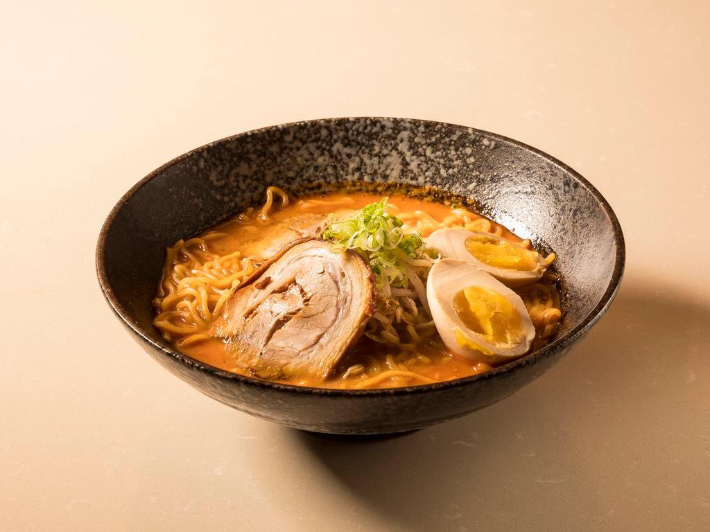 27. Spicy Garlic Miso Ramen · Pork broth with chef's special blend of miso, hot spices and thin noodles topped with pork chashu, a marinated egg, bamboo spears and bean sprouts.