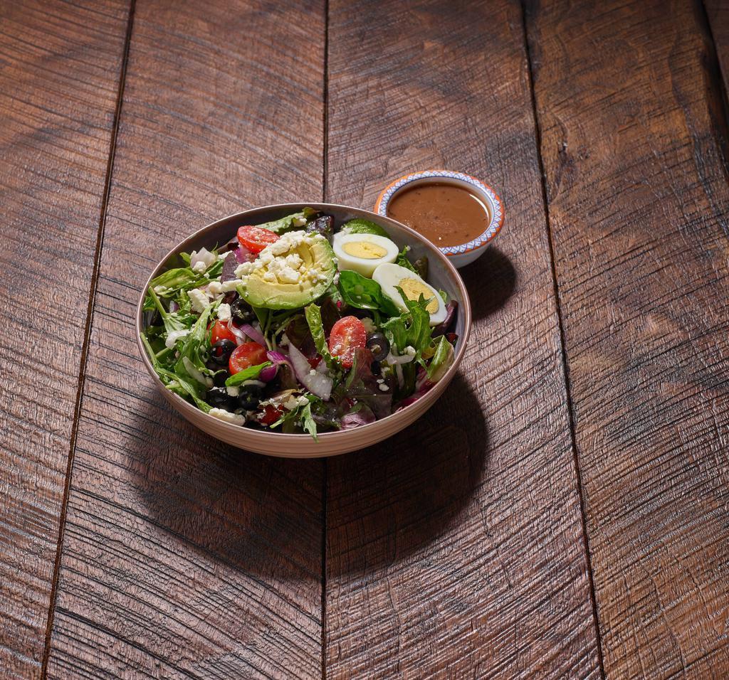 Greek Chef's Salad · Mixed greens, tomatoes, onions, olives, egg, avocado and feta cheese with balsamic vinaigrette.