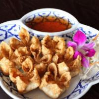 Crab Wonton · Deep fried wontons stuffed with crab meat and cream cheese served with our special sauce.