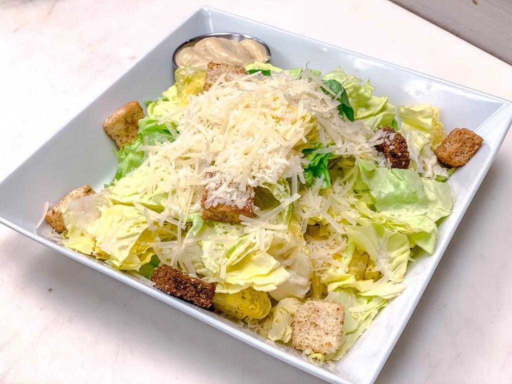 Caesar Salad · Romaine lettuce, rustic croutons, Parmesan cheese and Caesar dressing.