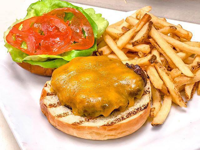 Cheeseburger · Cheddar, lettuce, tomato and brioche bun, served with fries