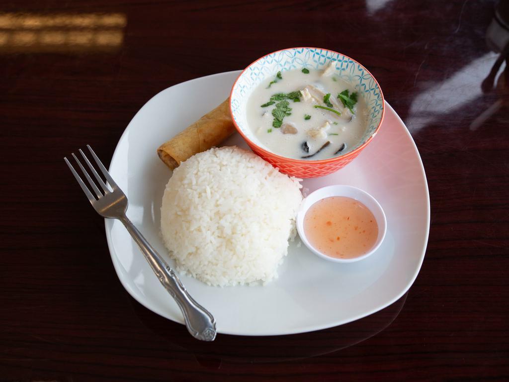 Tom Kha (Thai Coconut Soup) · Coconut milk, Galangal, Lime Leaves, Lemongrass, and Mushrooms. Served with Jasmine Rice and (1) Eggroll