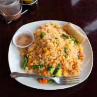 Fried Rice · Jasmine Rice Pan Fried w/ Mixed veggies: blend of carrot, corn, green bean, pea, onion and b...