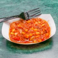 Bowl of Brunswick Stew · made with all of your favorite veggies and BBQ this stew is one of a kind!