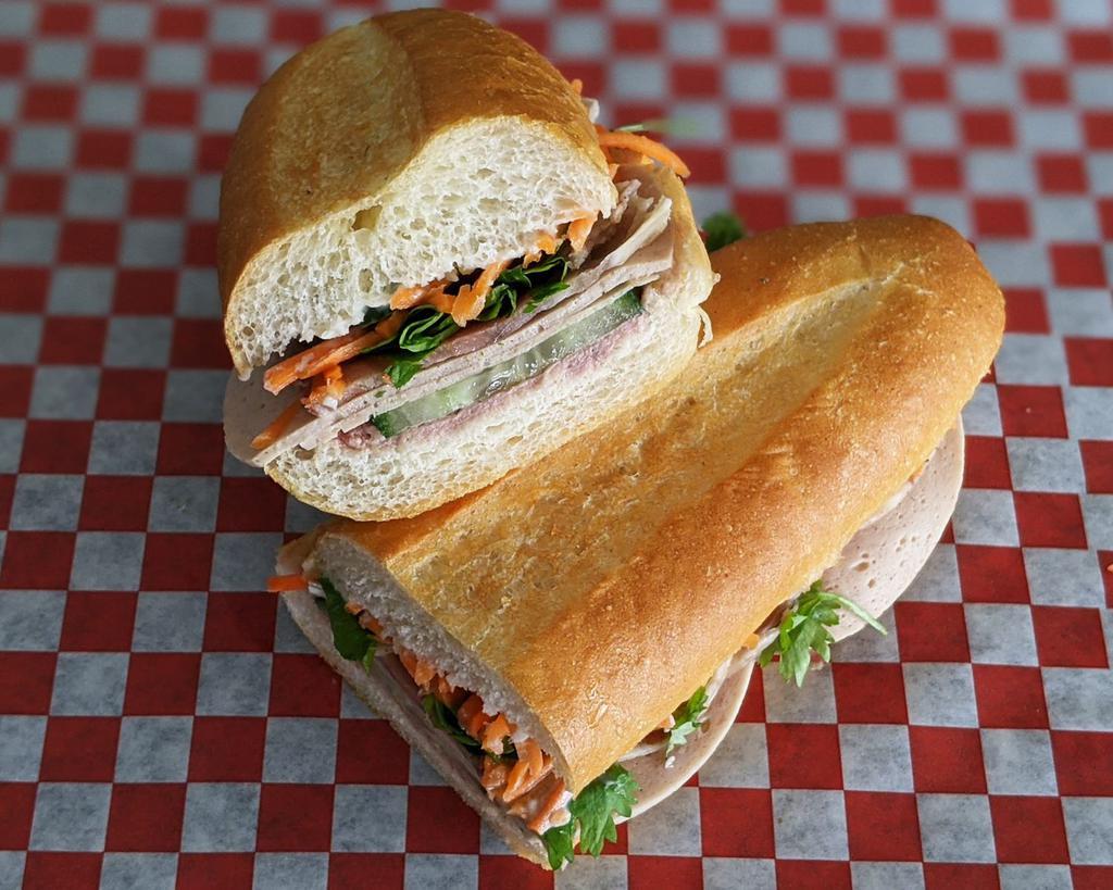Vietnamese Banh Mi Cold Cut Sandwich · With pate, Vietnamese sausage, cucumber, cilantro, jalapenos, pickled carrots, mayo on a french baguette. Spicy.
