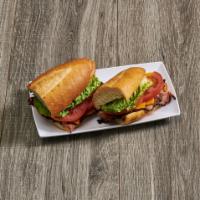 Pastrami Hot Sandwich · With lettuce, tomato, swiss, pickles, and yellow mustard.