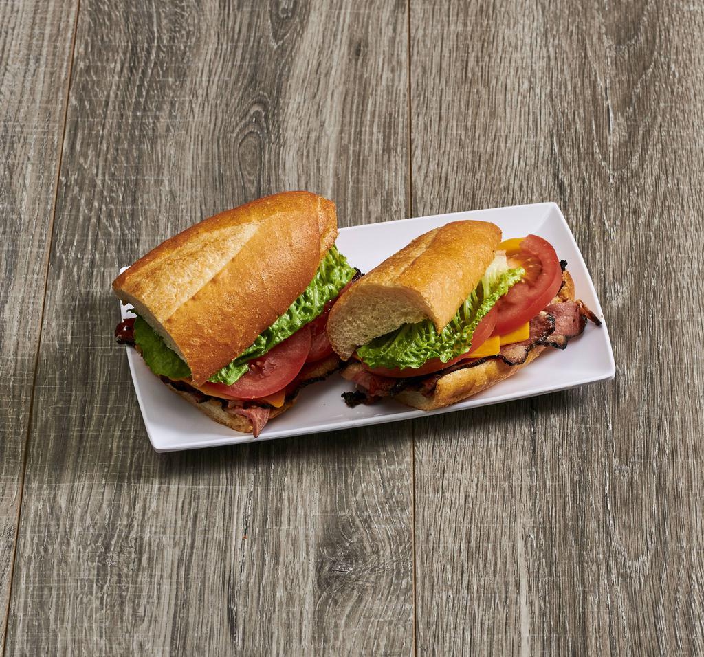 Pastrami Hot Sandwich · With lettuce, tomato, swiss, pickles, and yellow mustard.
