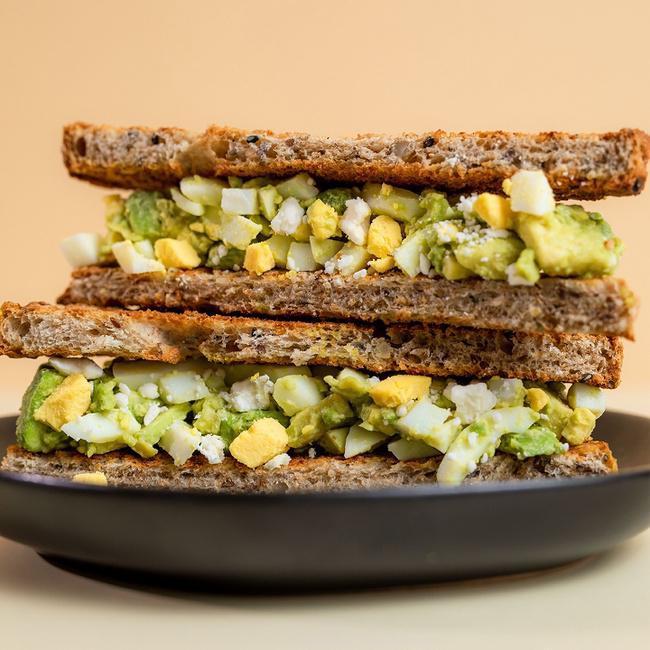 The Egg Salad Sandwich · Toasted Sprouted Bread, Hard-Boiled Egg, Avocado, Feta, Himalayan Pink Salt, Black Pepper & Garlic