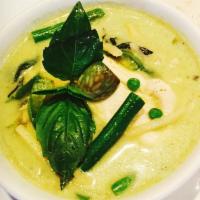 Green Curry · Green curry paste with coconut milk, fresh green beans, eggplant, sweet peas, and fresh Thai...