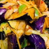 Eggplant · Stir-fried eggplant, onions, bell peppers, Thai basil, bamboo shoots, in a house made a sauce.